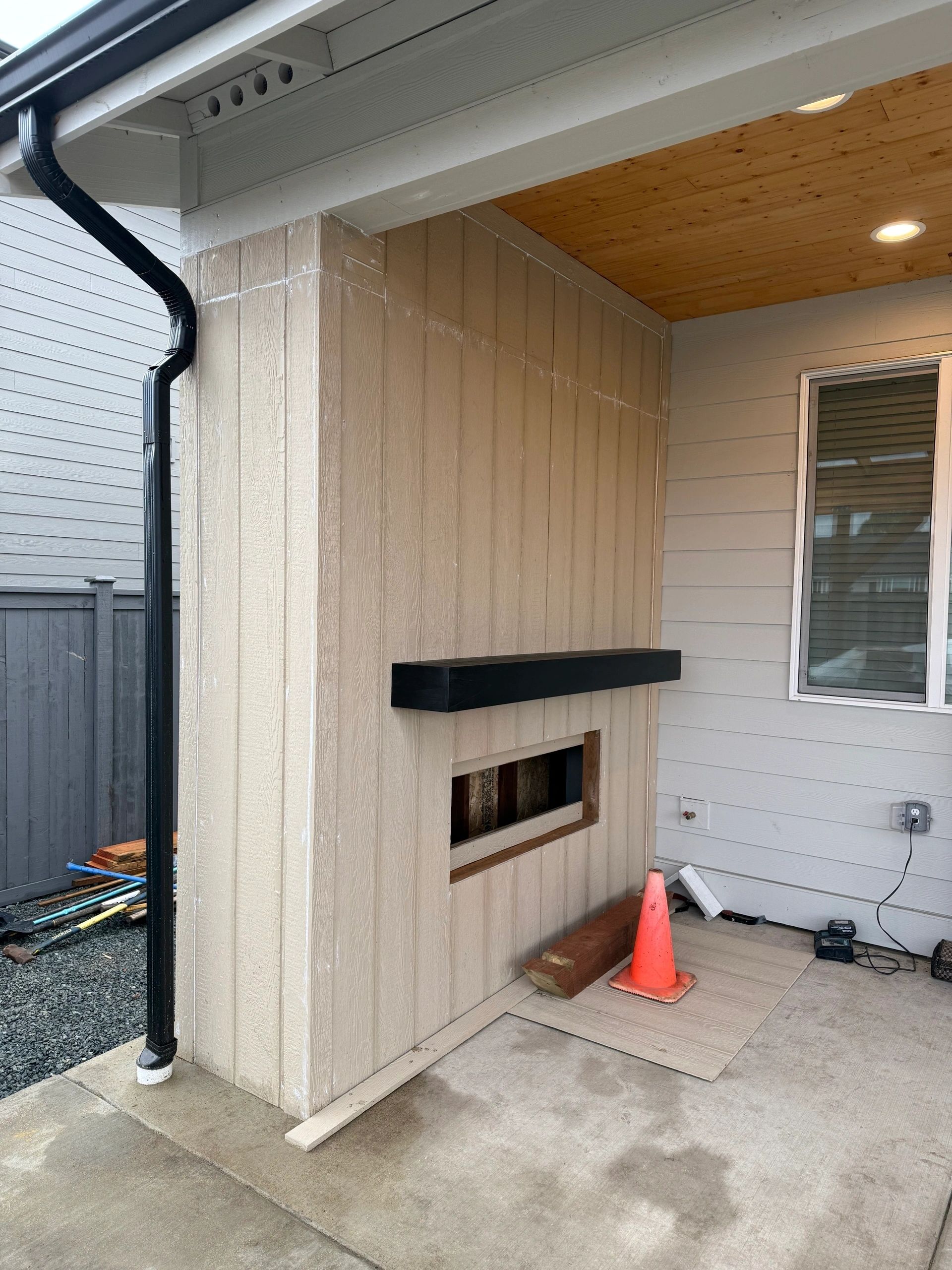 Covered patio with outdoor fireplace
